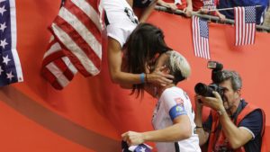 United States' Abby Wambach (20) gets a kiss from her wife, Sarah Huffman, after the U.S. beat Japan 5-2 in the FIFA Women's World Cup soccer championship in Vancouver, British Columbia, Canada, Sunday, July 5, 2015. (AP Photo/Elaine Thompson)